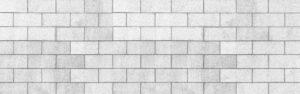 Panorama einer weißen Zementblock-Zaunbeschaffenheit und des nahtlosen Hintergrunds.